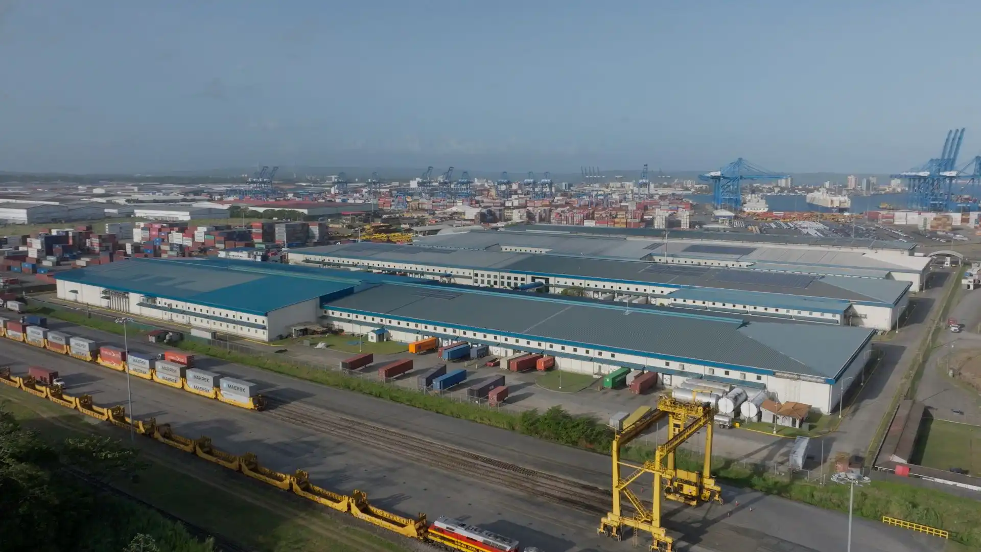 A forklift maneuvering through the organized aisles of a JCAIN distribution center, showcasing efficient inventory management.